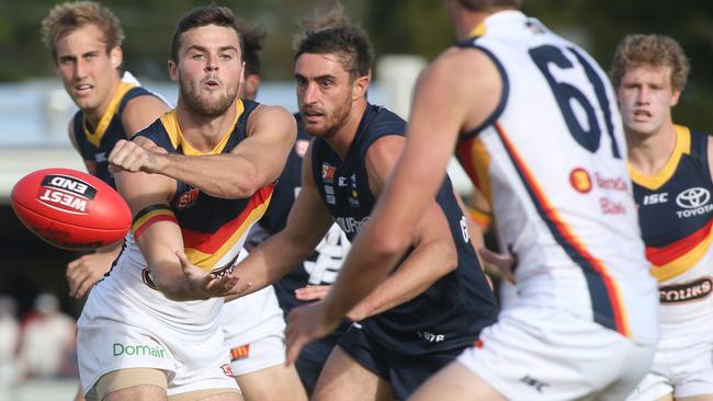 Adelaide Crows’ Brad Crouch handballs during the SANFL win against South Adelaide.