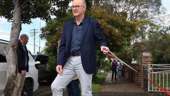 SYDNEY, AUSTRALIA - MAY 22: Prime minister-elect Anthony Albanese with his dog Toto together with his partner Jodie Haydon as he leaves his home on May 22, 2022 in Sydney, Australia. Labor leader Anthony Albanese will be sworn in as Australia's 31st Prime Minister on Monday following his victory over Scott Morrison in the Australia Federal Election (Photo by James D. Morgan/Getty Images)