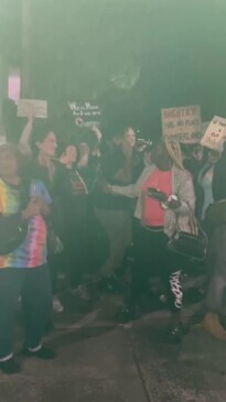 Supporters of same-sex books yell out “f--k off bigots"