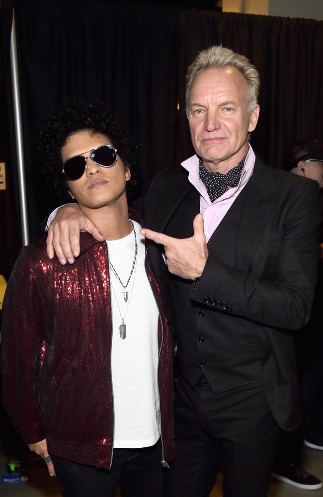 Recording artists Bruno Mars and Sting pose backstage at the 60th Annual GRAMMY Awards. Picture: Getty