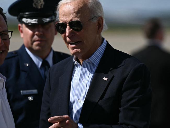 US President Joe Biden (R) is greeted by Pennsylvania Governor Josh Shapiro (L) upon arrival at Pittsburgh International Airport in Pittsburgh, Pennsylvania, on September 2, 2024. Biden is attending a campaign event with Vice Preside Kamala Harris. (Photo by Brendan SMIALOWSKI / AFP)