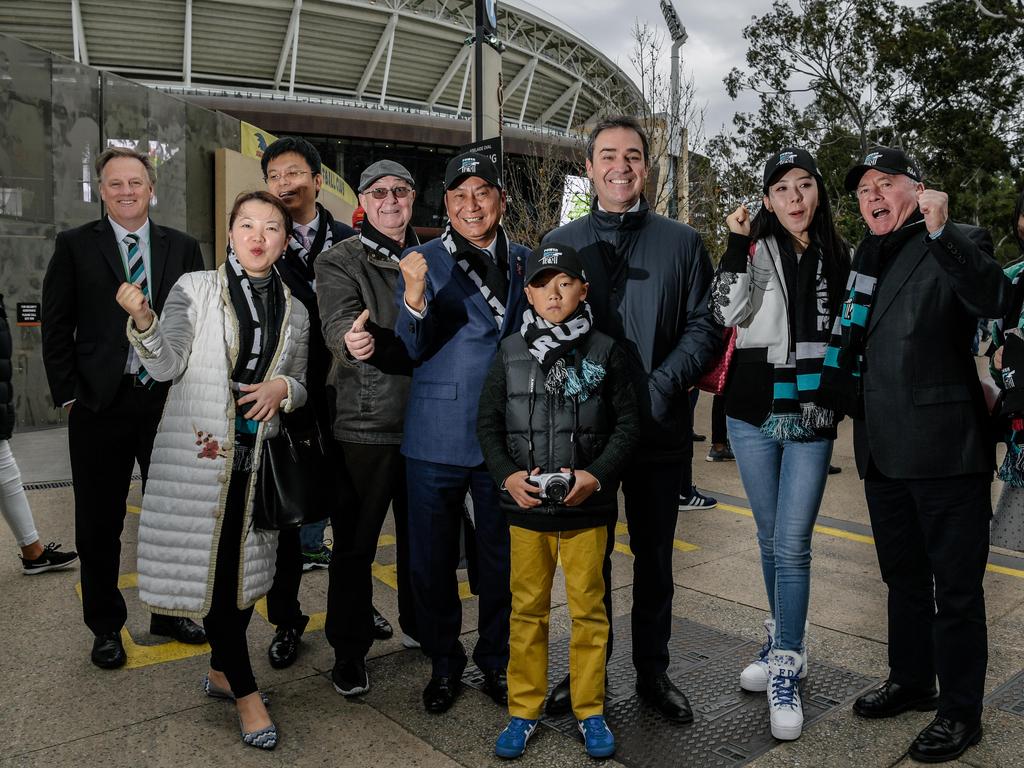 Premier Steven Marshall smiles flanked by members of the Chinese international group, hosted by Port Power, the Gincheng Zhejiang before Showdown 45. AAP Image/ Morgan Sette