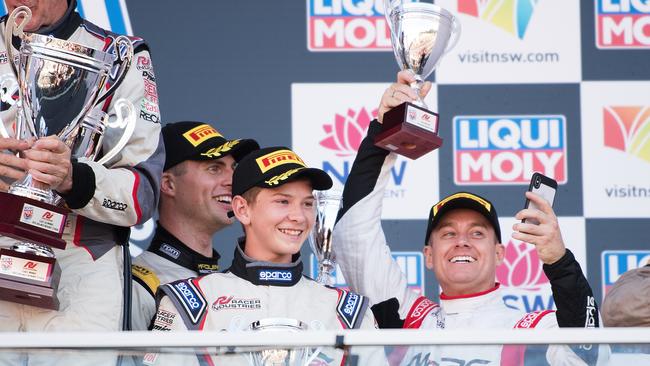 Grant Denyer celebrates on the podium during the 2018 Bathurst 12 Hour Race at Mount Panorama. Picture: Daniel Kalisz/Getty Images