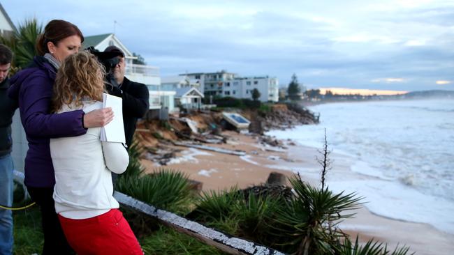 Mrs Silk is comforted by Sunrise reporter Natalie Barr. Picture: John Grainger