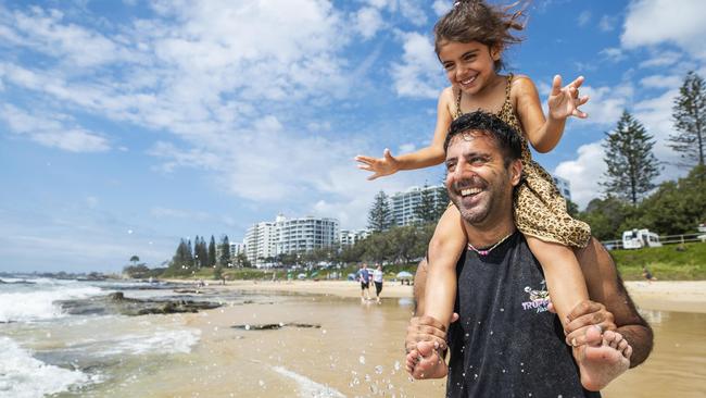 Tony Rehal from Brisbane enjoys Fathers Day at the beach with his five-year-old daughter Kyah at Mooloolaba. Picture: Lachie Millard