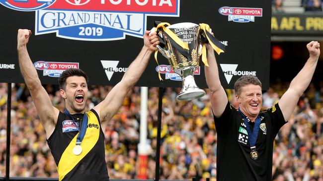 Richmond captain Trent Cotchin and coach Damien Hardwick present the Premiership Cup to the Tigers faithful at the MCG. Picture: Michael Klein.