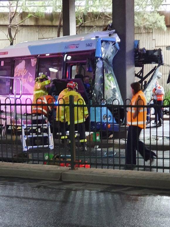 Two passengers and a bus driver were trapped in a bus after it crashed into a pylon. Picture: Twitter