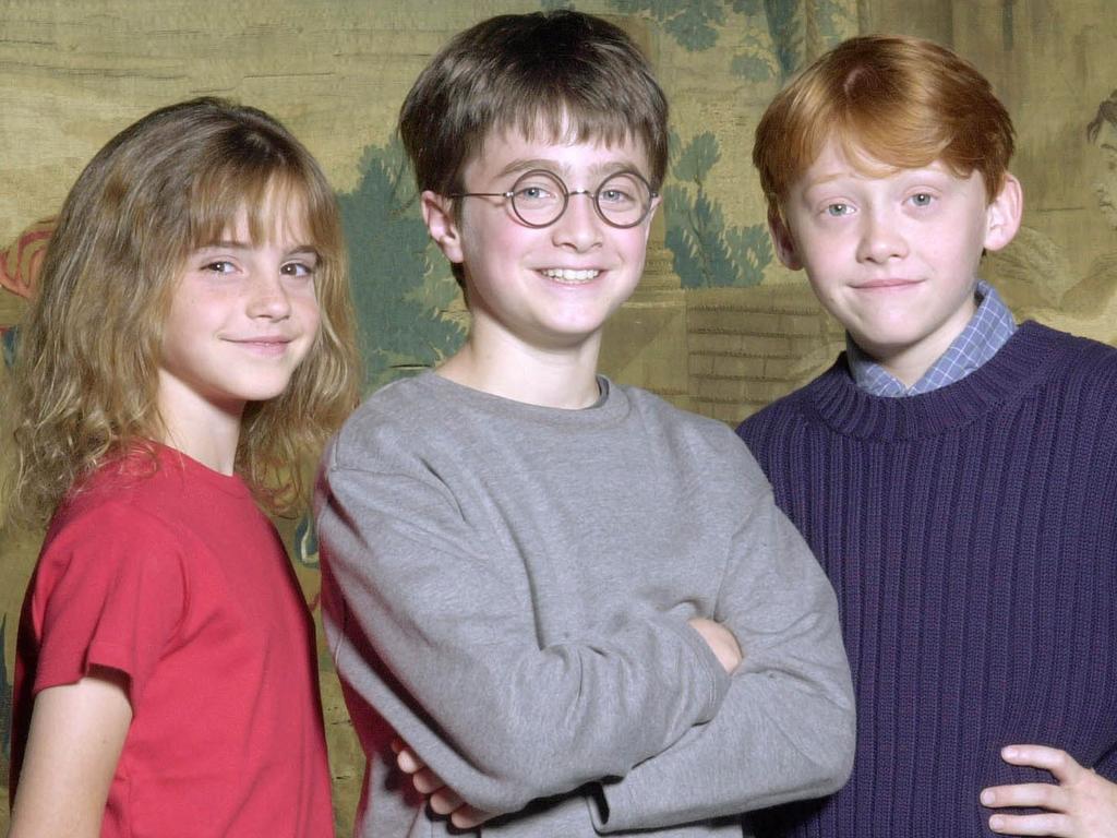 Daniel Radcliffe, aged 11 (centre), alongside his young co-stars Emma Watson, 10, and Rupert Grint, 11, in the year 2000.