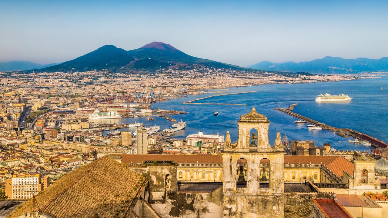 Today’s vibrant, picturesque Italian port city of Napoli (Naples) sits below with famous Mount Vesuvius, which erupted and completely buried the city of Pompeii in 79 CE. Picture: iStock