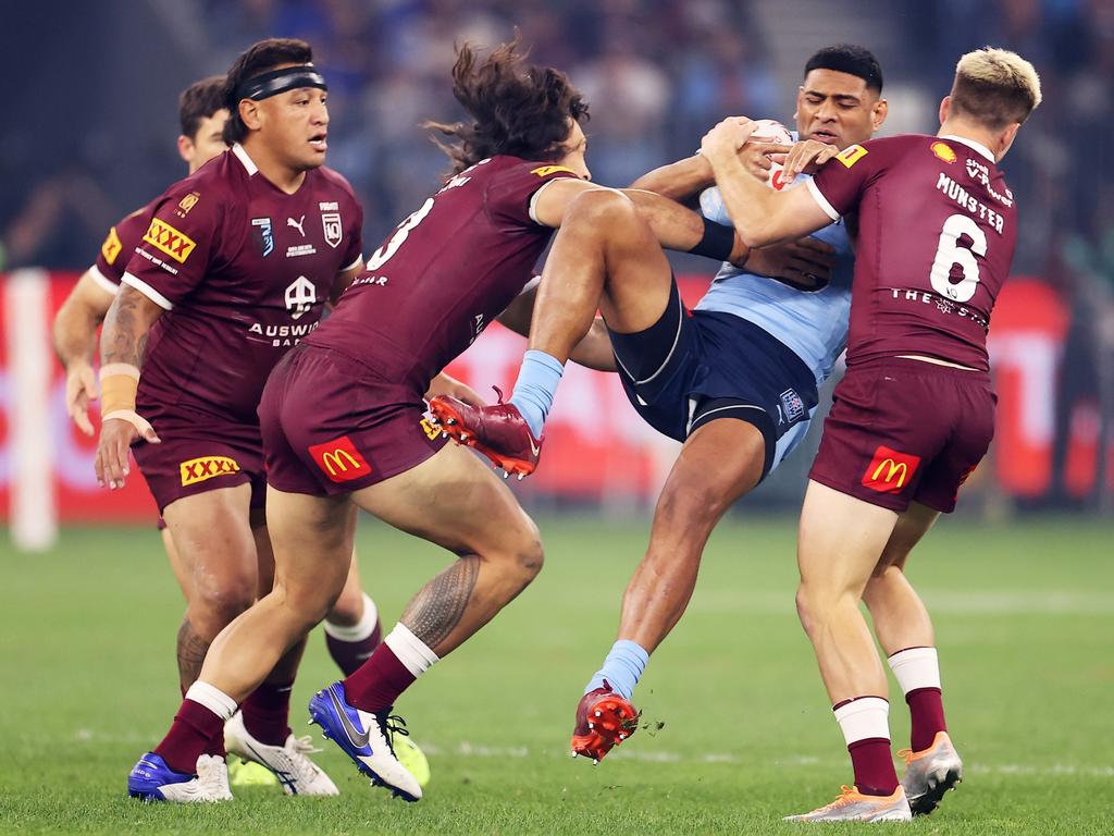 Daniel Tupou is up-ended. Picture: Mark Kolbe/Getty