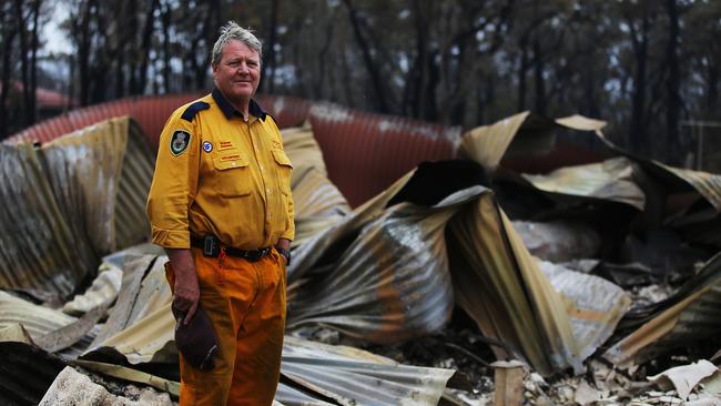 RFS Volunteer Russell Schoels on December 22 at his property that burnt down as he helped defend his neighbours property. Fires ripped through the small town of Balmoral south west of Sydney for a second time in a week. Picture: Jane Dempster