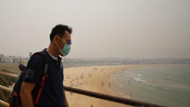 Health experts say people should stay inside and wear P2 masks to avoid the serious long-term health impacts of exposure to hazardous smoke over a few weeks or months. Picture: Steven Saphore