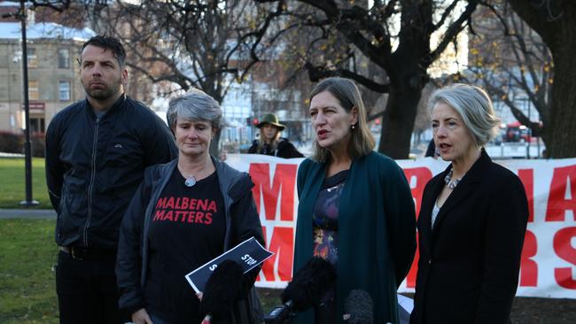 Tom Allen from the Wilderness Society, Jen Smith from Fishers and Walkers Tasmania, Greens leader Cassy O'Connor and Greens MP Rosalie Woodruff outside state parliament in Hobart on Thursday July 1, 2020.