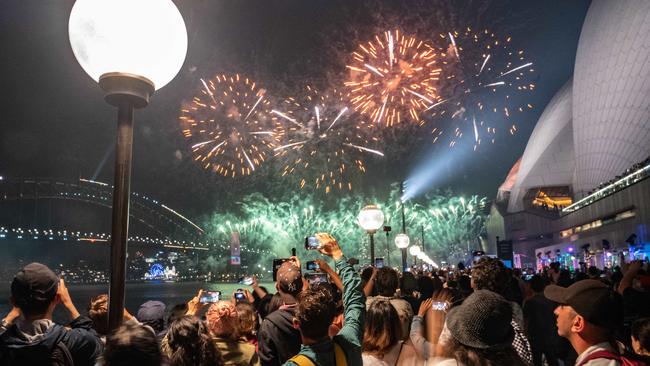 SYDNEY, AUSTRALIA - NewsWire Photos 31 DEC, 2022: People are seen celebrating on the crowded foreshore of Circular Quay in Sydney the New Year's Eve   Picture: NCA NewsWire / Flavio Brancaleone