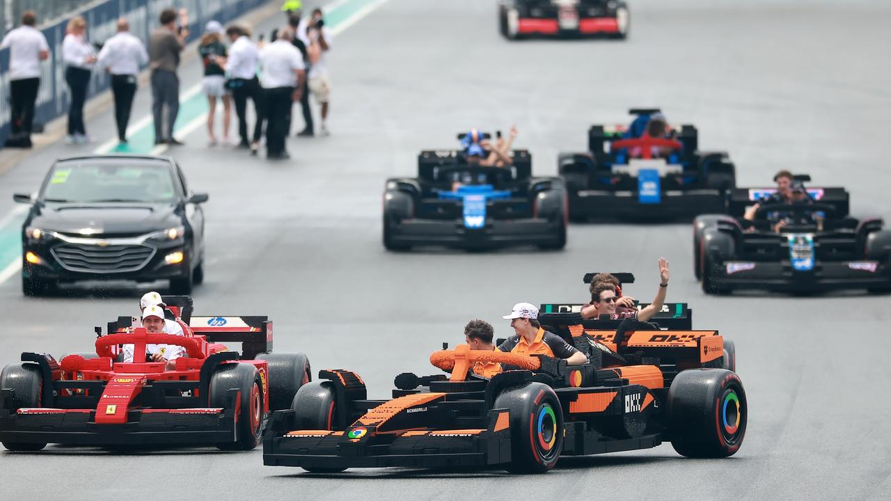 Lando Norris tries to cut off Ferrari in his Lego McLaren. Photo: Hector Vivas/Getty Images for LEGO Group.