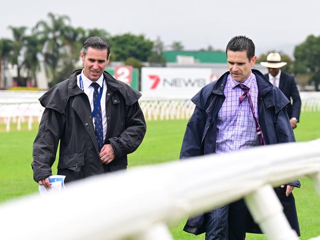 Stewards and jockeys inspect the Gold Coast track before calling off the Magic Millions meeting. Picture: Grant Peters - Trackside Photography