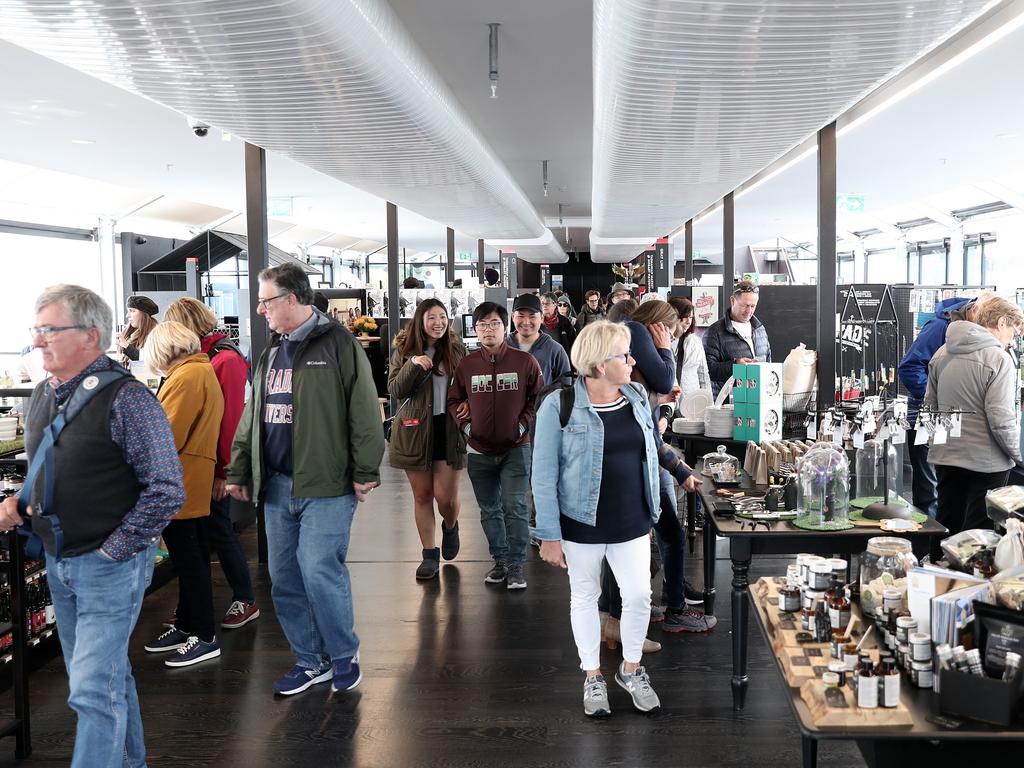 Brooke Street Piers' shops packed with tourists with two cruise ships docked in Hobart. Picture: LUKE BOWDEN