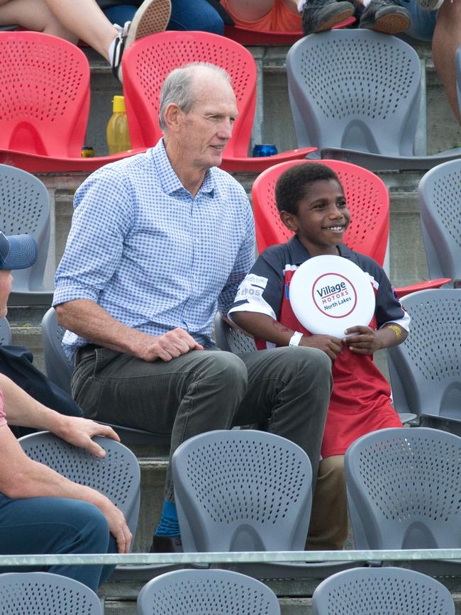 Wayne Bennett with a young fan Redcliffe’s stadium. Picture: AAP/Richard Walker