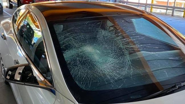 The vandal smashed the Tesla’s windscreen and broke the side mirror. Picture: Jules Boag