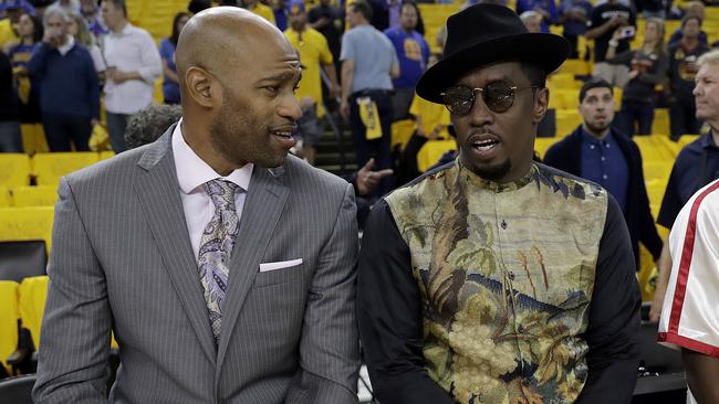 Vince Carter and musician Sean "Diddy" Combs before game five. Picture: AP