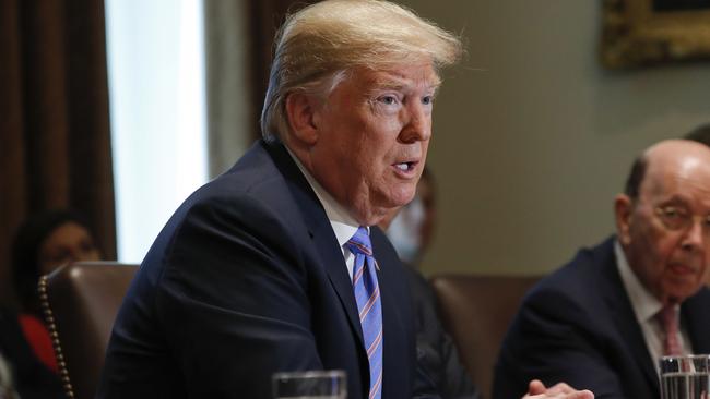 Donald Trump speaks with members of his cabinet. Picture: AP.