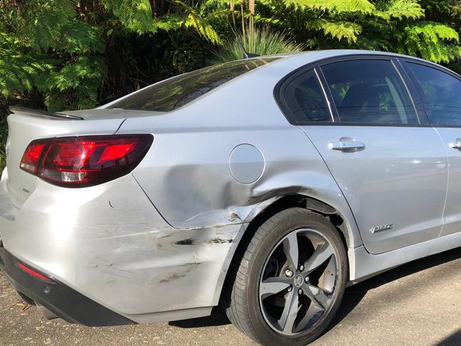 A Holden Commodore damaged on Macquarie St, Cromer Heights, when an alleged drink driving mother, with her five-year-old daughter in the back seat, crashed into it. Picture: Abby O’Rourke