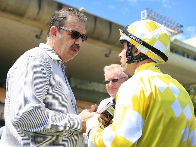 John Sargent talks to jockey Brenton Avdulla after winning a race at Canterbury midweek races. Picture: Mark Evans