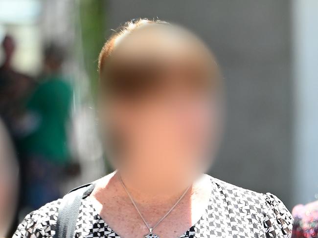 BRISBANE, AUSTRALIA - NewsWIRE Photos OCTOBER 16, 2023: ### WARNING DO NOT USE WITHOUT BLURRING FACES ### A Queensland mother (Centre) leaves court after her sentence for a change of conspiring to defeat justice was adjourned. Picture: NCA NewsWIRE / John Gass