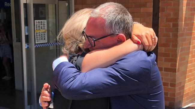 The pair embrace outside of court