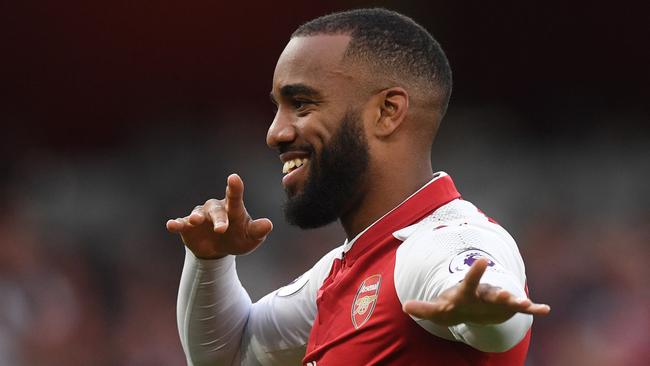 Lacazette celebrates after scoring.