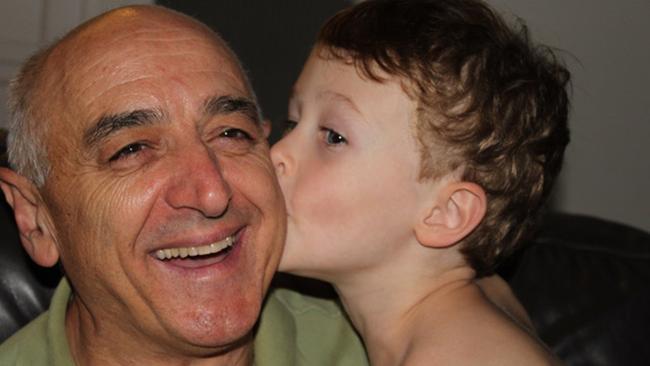 Philip Ferrarotto with his first grandchild Thomas in 2012. Picture: Supplied