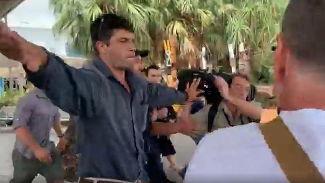 Matt Wright's bodyguards clash with media in fiery scenes at Darwin Airport. Picture: Sky News