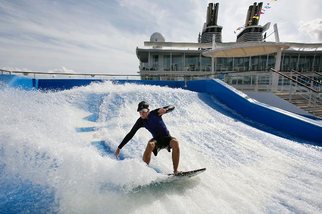 <p>A man tries out one of two surf simulators on board the cruise ship / AP</p> <br/>