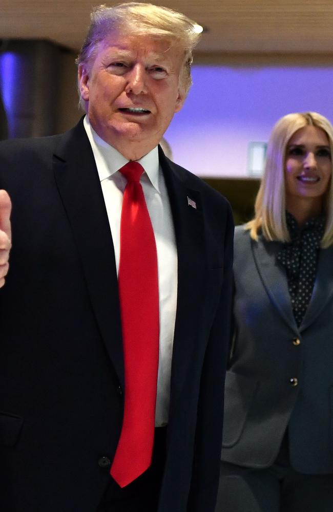 US President Donald Trump is flanked by daughter Ivanka Trump at the World Economic Forum in Davos. Picture: AFP