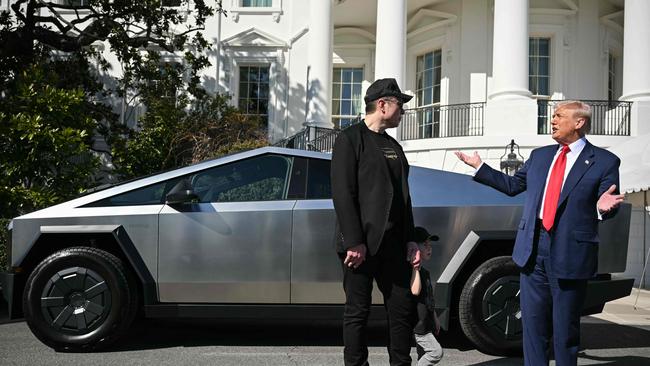 Elon Musk with Donald Trump and a Tesla Cybertruck at the White House.