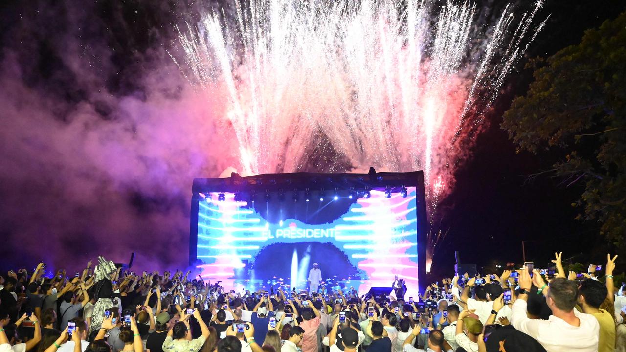 People cheer as President of El Salvador announces his plans for a bitcoin city. Picture: Marvin Recinos/AFP.