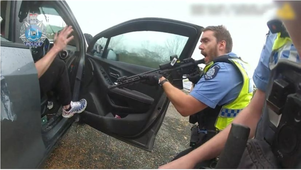 Armed police arrested the two fugitives in remote WA following the alleged kidnapping and shooting of a man in NSW. Picture: Supplied/WA Police