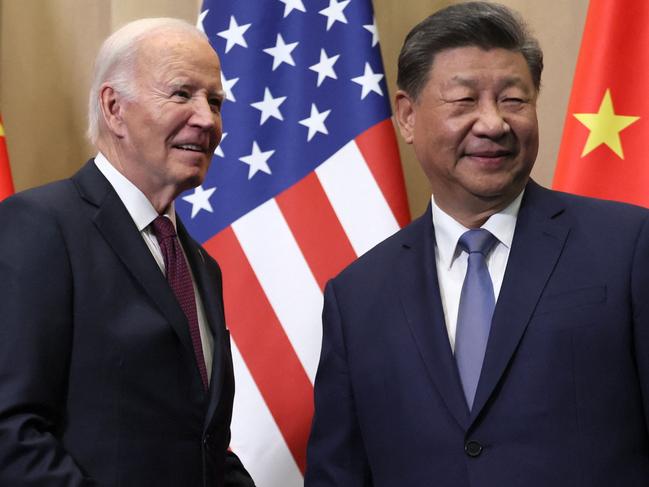 US President Joe Biden (L) speaks with Chinese President Xi Jinping on the sidelines of the Asia-Pacific Economic Cooperation (APEC) summit in Lima, Peru, November 16, 2024. (Photo by Leah Millis / POOL / AFP)