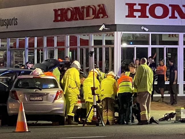 Emergency services work to free motorist after a two-vehicle crash in Rosslea on Friday evening. Photo: Leighton Smith.