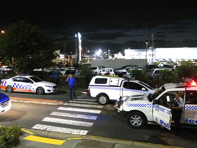 NSW and QLD Police closed off the front of Big W at Tweed City as staff stand around during the Police Incident Tweed City involving stolen car and 4 male offenders. Photo: Scott Powick Daily News