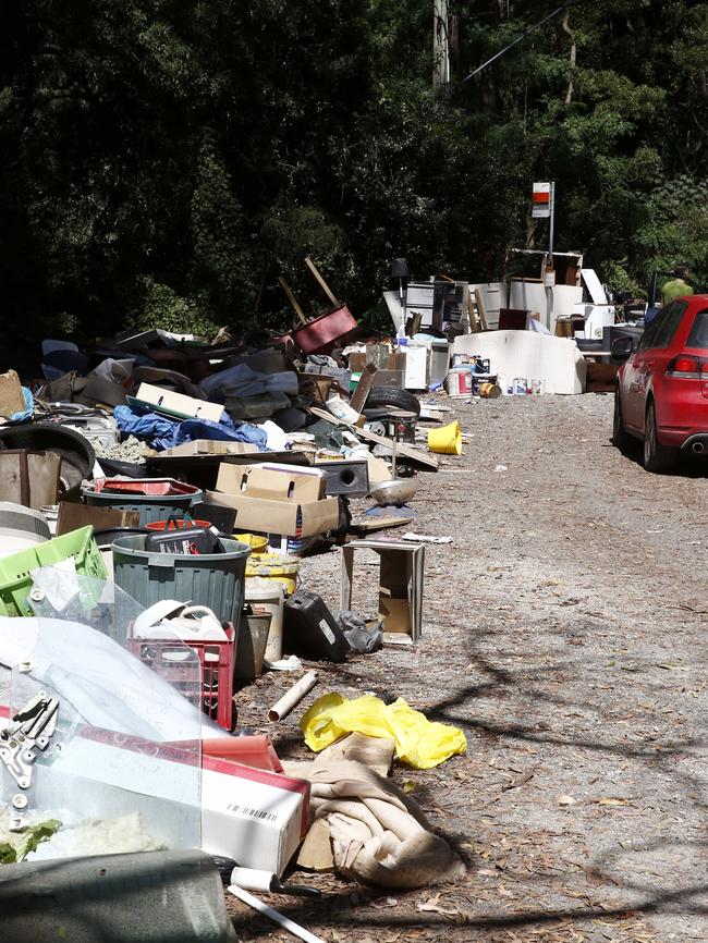 A hard rubbish pile stretches about 20m along the roadside. Picture: Paul Loughnan