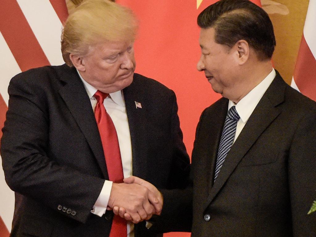 US President Donald Trump (L) shakes hand with China's President Xi Jinping. Picture: AFP