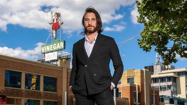 Musician and children’s book author Nic Cester at the skipping girl landmark in Abbotsford, Melbourne. Picture: Ian Currie