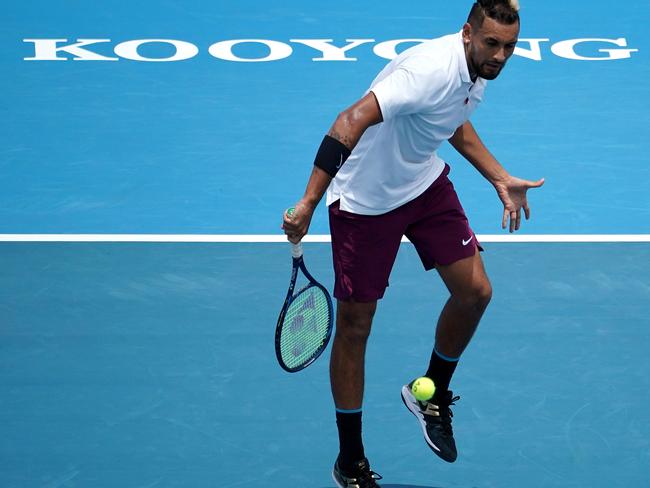 Nick Kyrgios of Australia plays a backhand in his Mens Singles match against Grigor Dimitrov of Bulgaria  during the Kooyong Classic at the Kooyong Lawn Tennis Club in Melbourne, Thursday, January 16, 2020. (AAP Image/Sean Garnsworthy) NO ARCHIVING, EDITORIAL USE ONLY