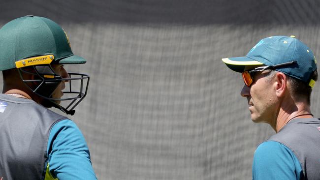 Usman Khawaja of Australia talks with team coach Justin Langer in the nets, during the Boxing Day Test nets session in Melbourne, Sunday, December 23, 2018. (AAP Image/Mark Dadswell) NO ARCHIVING, EDITORIAL USE ONLY