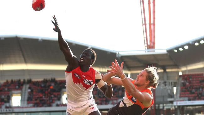 Sydney's Aliir Aliir rises above Harry Himmelberg to spoil. Picture: Phil Hillyard.