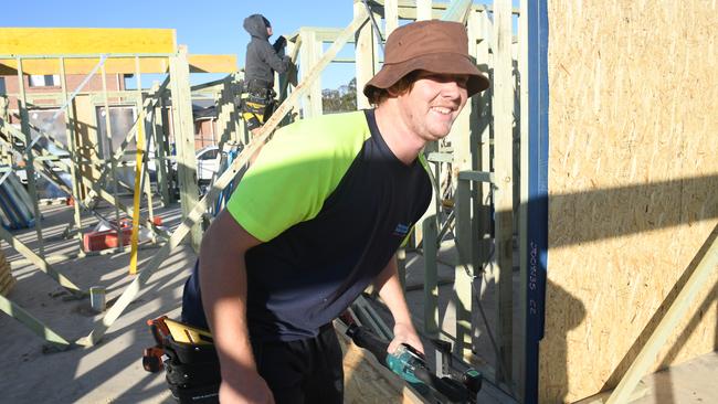 A carpenter helping build a new in home is Sydney’s western suburbs. Picture: AAP