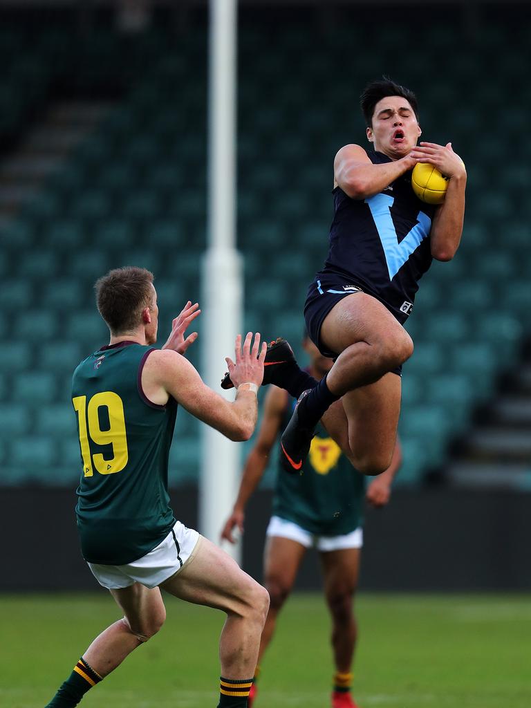 Vic Metro Joseph Fisher marks during the game against Tasmania at UTAS Stadium. PICTURE CHRIS KIDD