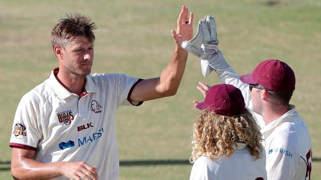 Cameron Gannon of Queensland is congratulated by teammates. (AAP Image/Richard Wainwright)