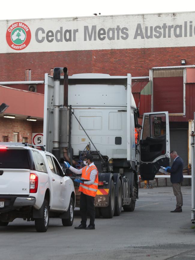 Staff arriving at Cedar Meats on Monday last week. Picture: David Crosling